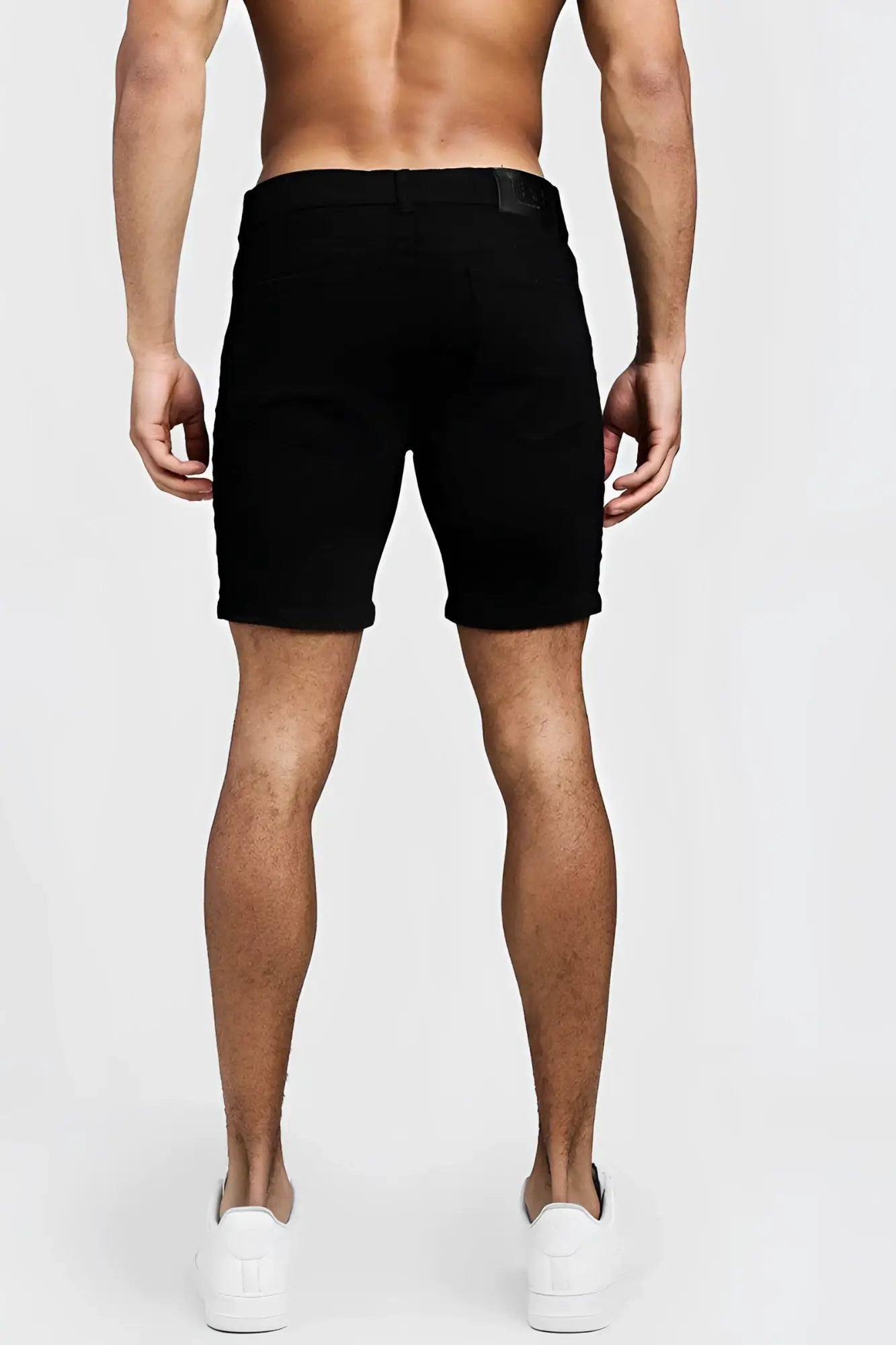 Black denim shorts by boohoo with skinny fit side tape and subtle brand label size 32 mid-thigh length