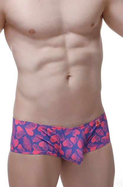Boxer Chill Tropical Hearts vibrant pink and purple tropical leaf-patterned men’s briefs with a red logo waistband