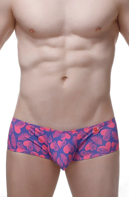Boxer Chill Tropical Hearts vibrant pink and purple swim trunks with heart and leaf patterns for summer beachwear
