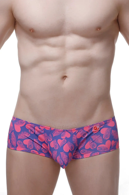 Boxer Chill Tropical Hearts vibrant pink and purple swim trunks with heart and leaf patterns for summer beachwear
