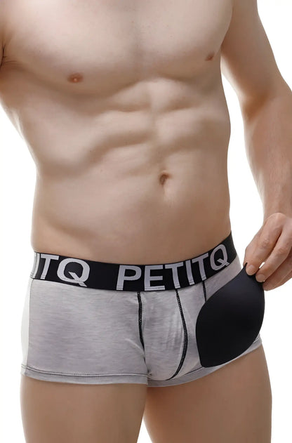 Gray and black petitq men’s modal boxer briefs with contoured gel pad on the right side for enhanced comfort