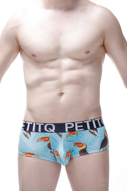 Light blue men’s boxer briefs with vibrant toucan and tropical leaf pattern and black petitq waistband