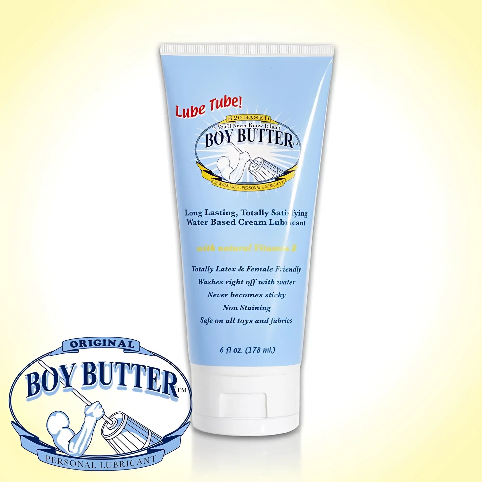 Light blue plastic tube of boy butter h2o personal lubricant with white cap and label showing brand logo and muscular arm design