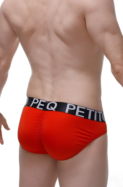 Red men’s briefs bulan plum red with black elastic waistband and white peq petit lettering for comfortable wear