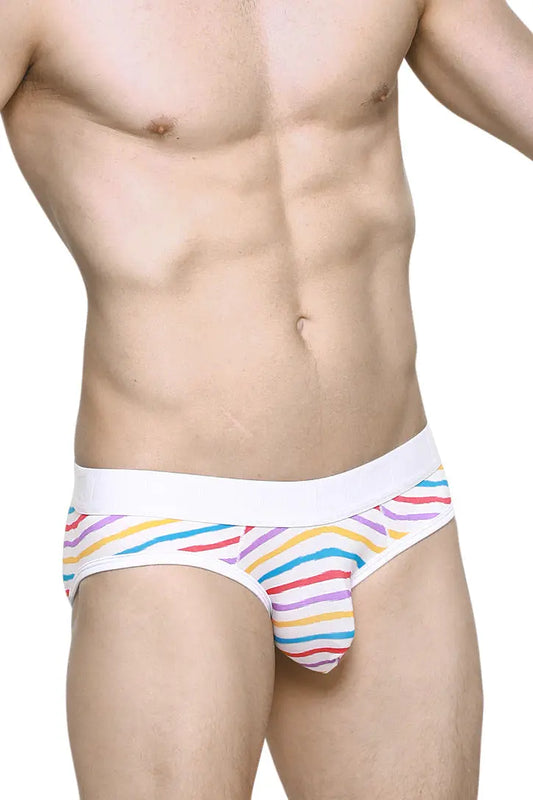 Men's brief in white with colorful candy stripes featuring a comfortable waistband modeled by a man by PetitQ