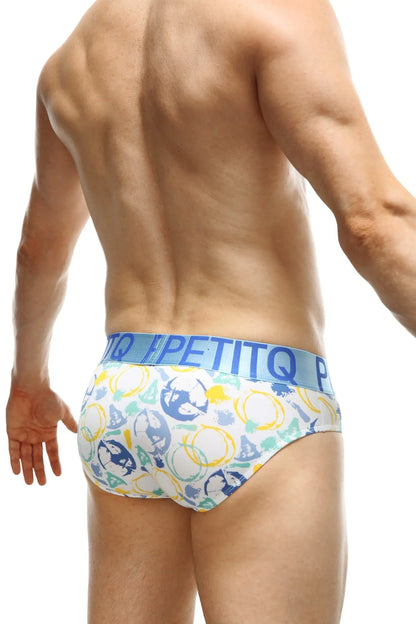 White briefs with playful blue yellow and green geometric shapes and skulls and a light blue petitq waistband