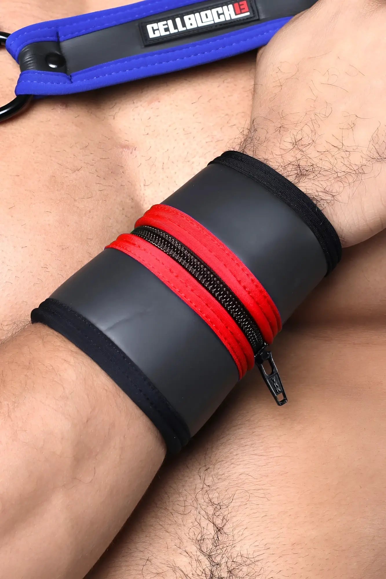 Black and red leather buckle up cuff wristband with zipper closure and cellblock branded blue strap available in 5 colors