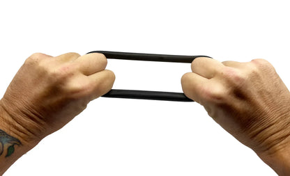 Bufu ring black rubber band being stretched between two hands showing its elasticity and flexibility