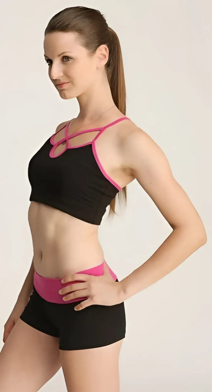 Black and pink bumble short sports bra with crisscross straps and matching waistband for activewear