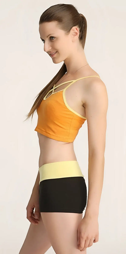 Orange and yellow cropped top with thin straps and matching high-waisted black shorts bumble short set