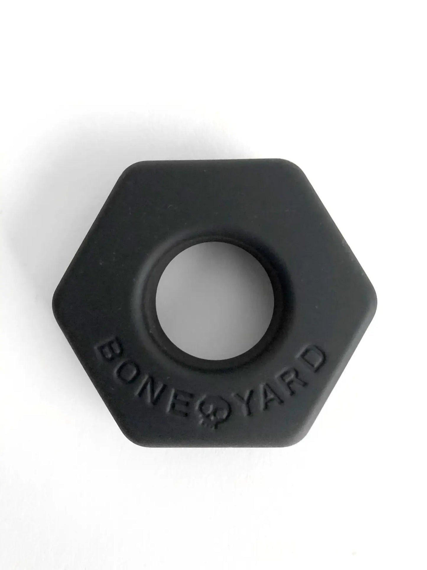 Black hexagonal silicone ring bust a nut with bone yard embossed around the center for comfortable everyday wear