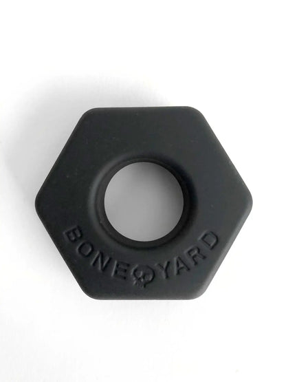 Black hexagonal silicone ring bust a nut with bone yard embossed around the center for comfortable everyday wear