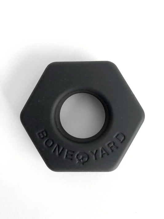Black hexagonal silicone ring bust a nut with bone yard embossed around the center for comfortable everyday wear