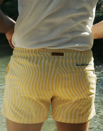 Byron swim short in yellow and white wavy stripes with a brown leather la dolce vita brand tag