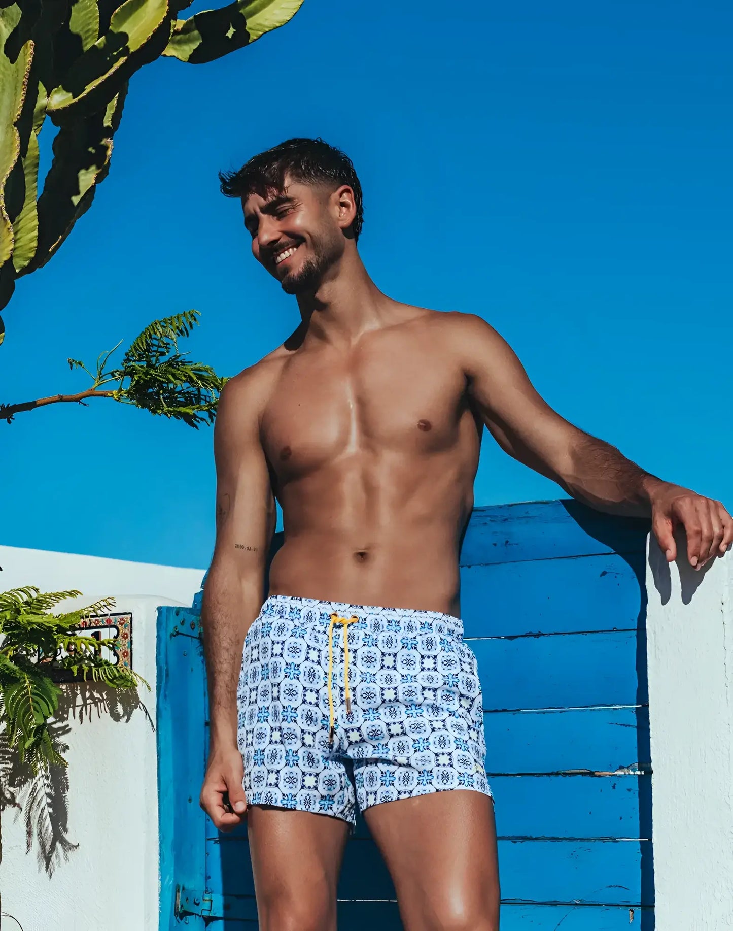 Byron swim short mykonos print white swim trunks with blue geometric pattern and yellow drawstring for beachwear
