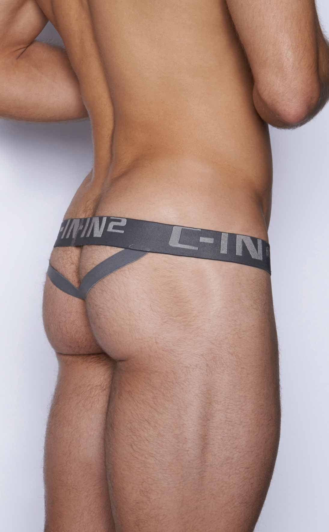 Gray c-in2 y-back thong with wide waistband and supportive side straps shown from the back side