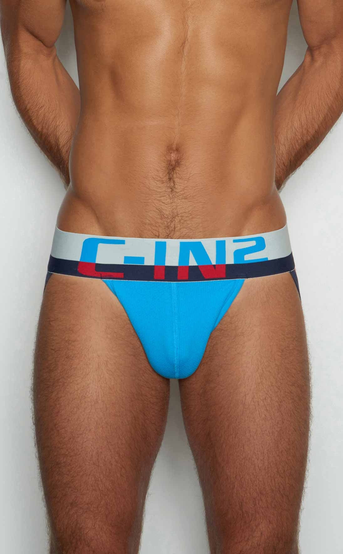 Bright blue c-in2 briefs with a white and navy waistband featuring bold red lettering for athletic use