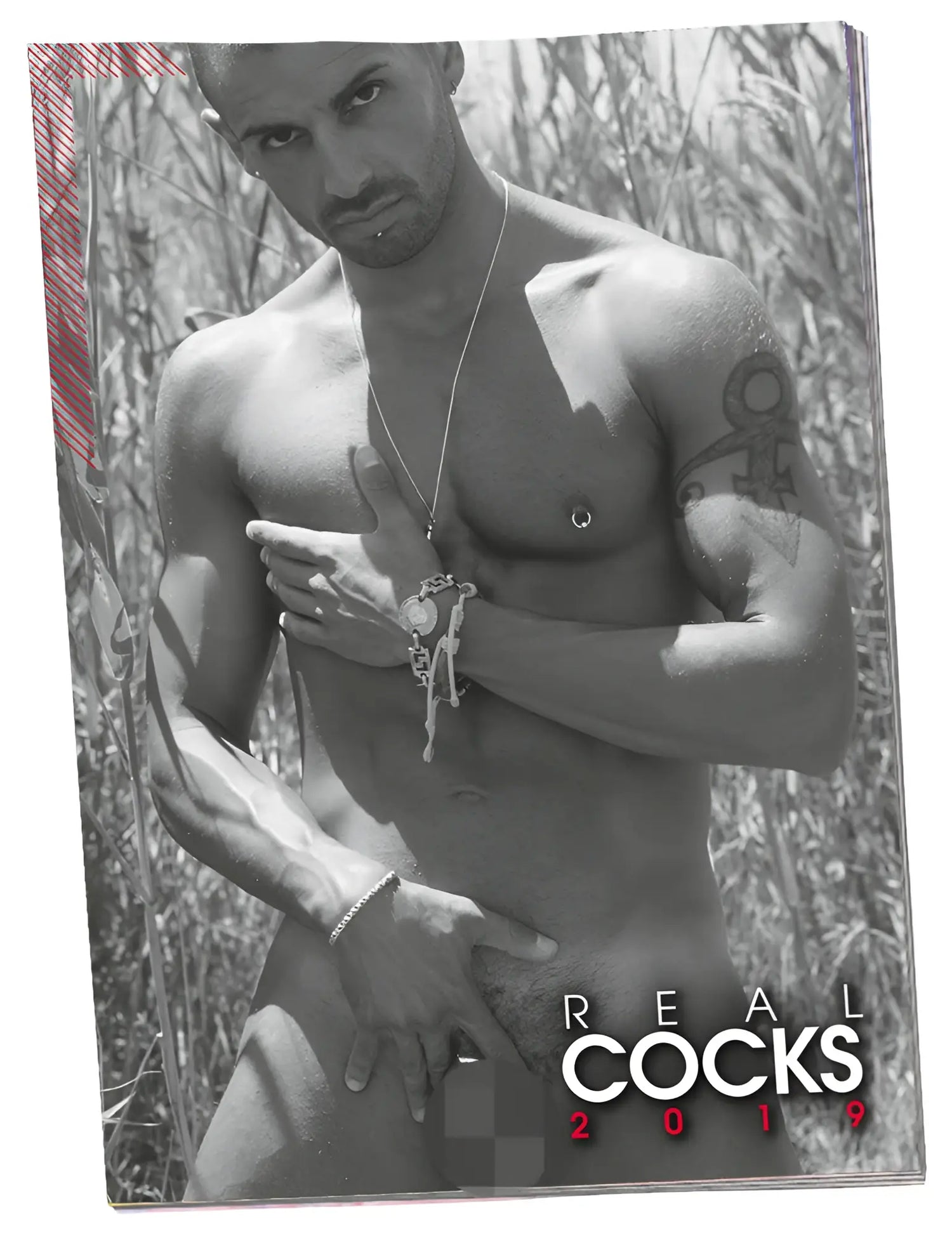 Black-and-white magazine cover featuring a muscular tattooed man wearing silver chain necklace and bracelet calendar 2019 pin up real cocks