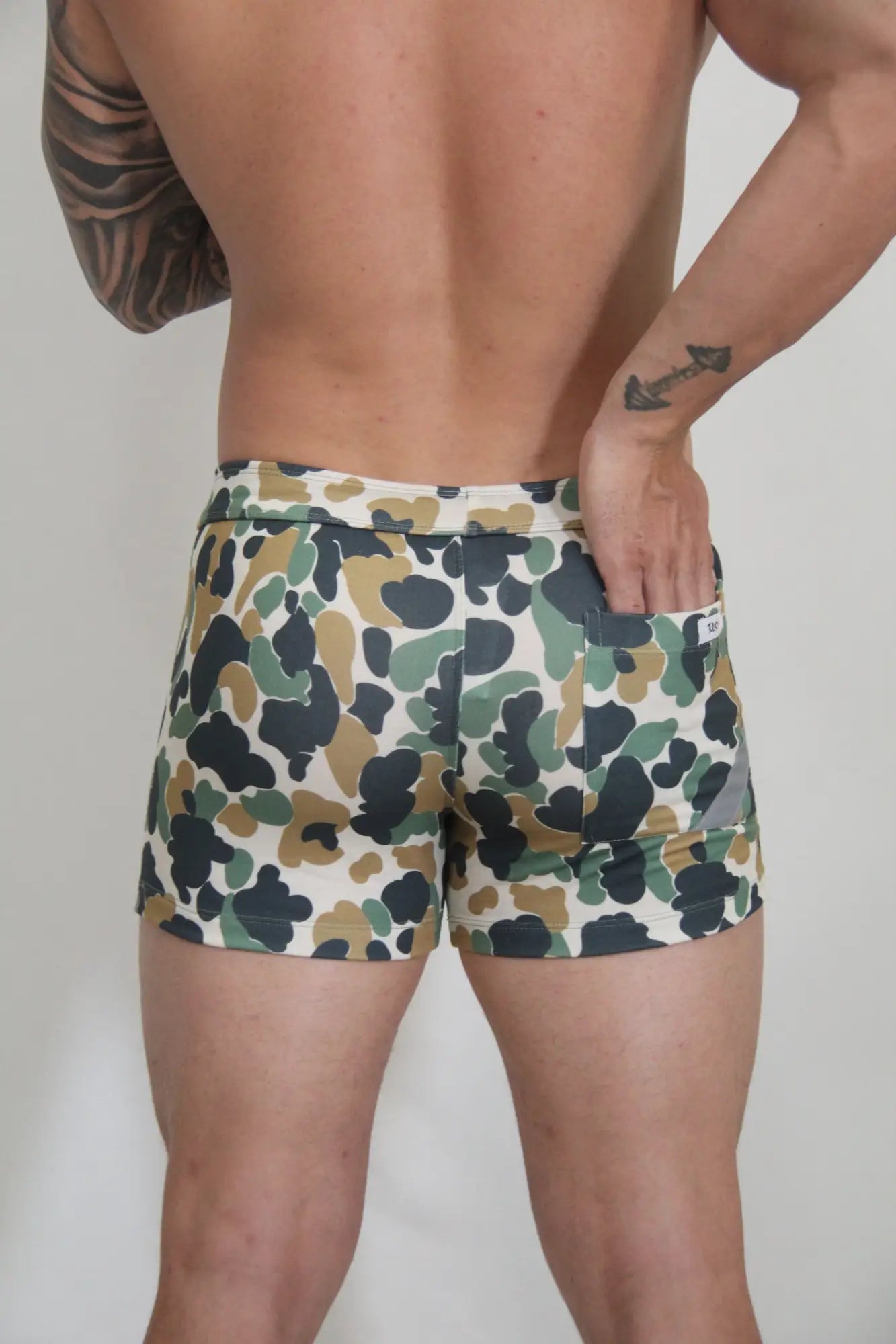 Camouflage fleece shorts for men in green brown and white tones featuring a soft fleece material