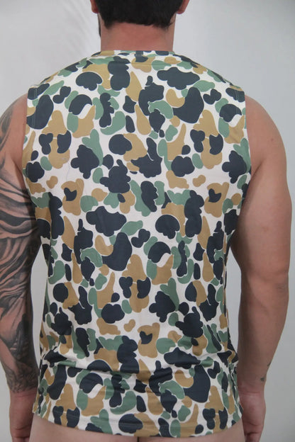 Camouflage open arm tank is a sleeveless top with olive green tan and black splotches on a white base