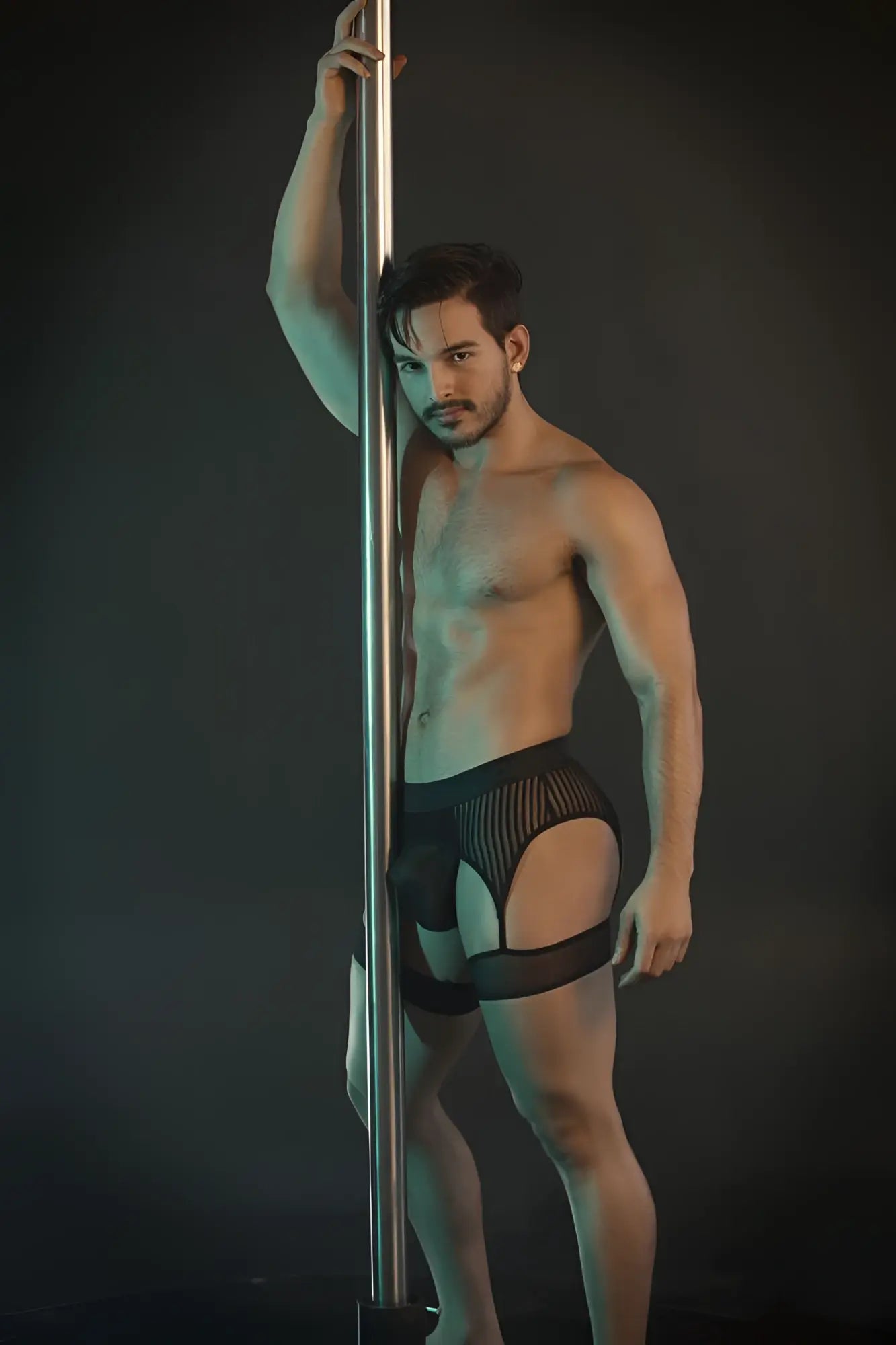 CandyMan 99403 black pole dance briefs with black mesh and solid panel back side shown