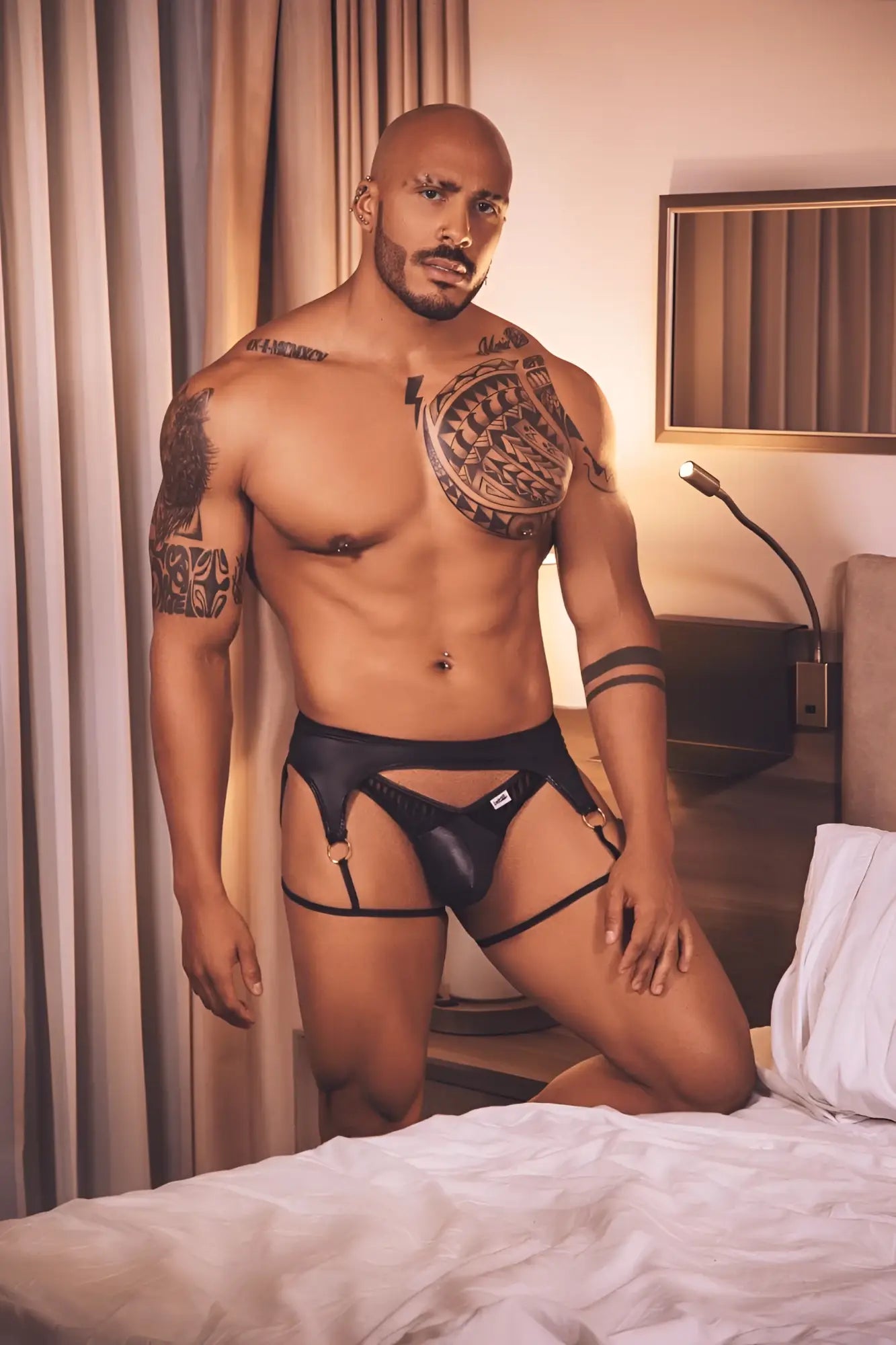 CandyMan 99655 black leather garter thong with adjustable straps and small white logo on the front
