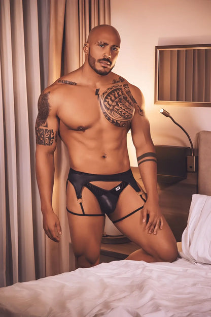 CandyMan 99655 black leather garter thong with adjustable straps and small white logo on the front