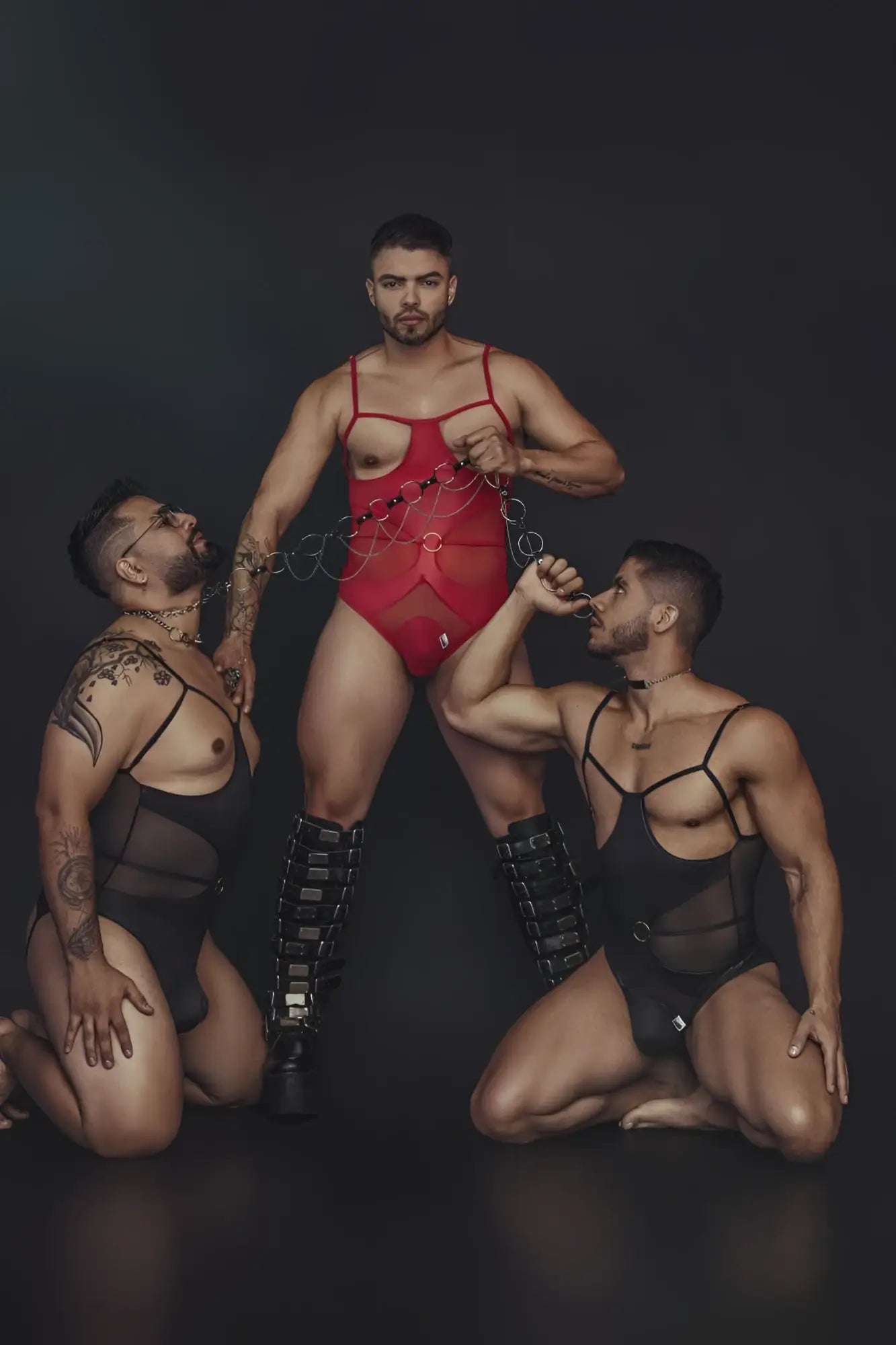 Red CandyMan 99670 harness bodysuit with thin straps and chest cutout in a sleek stretchy fabric