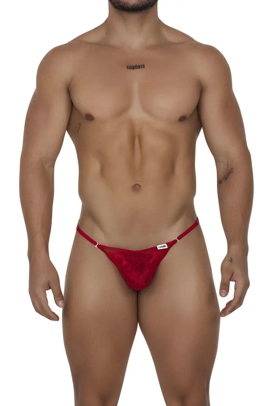 Red lace thong with a small white brand tag on the waistband from CandyMan 99685 lace thongs in red color