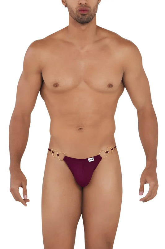 Maroon thong with gold toned ring detailing at the waistband from candyman 99710 holes in one bikini burgundy view of back