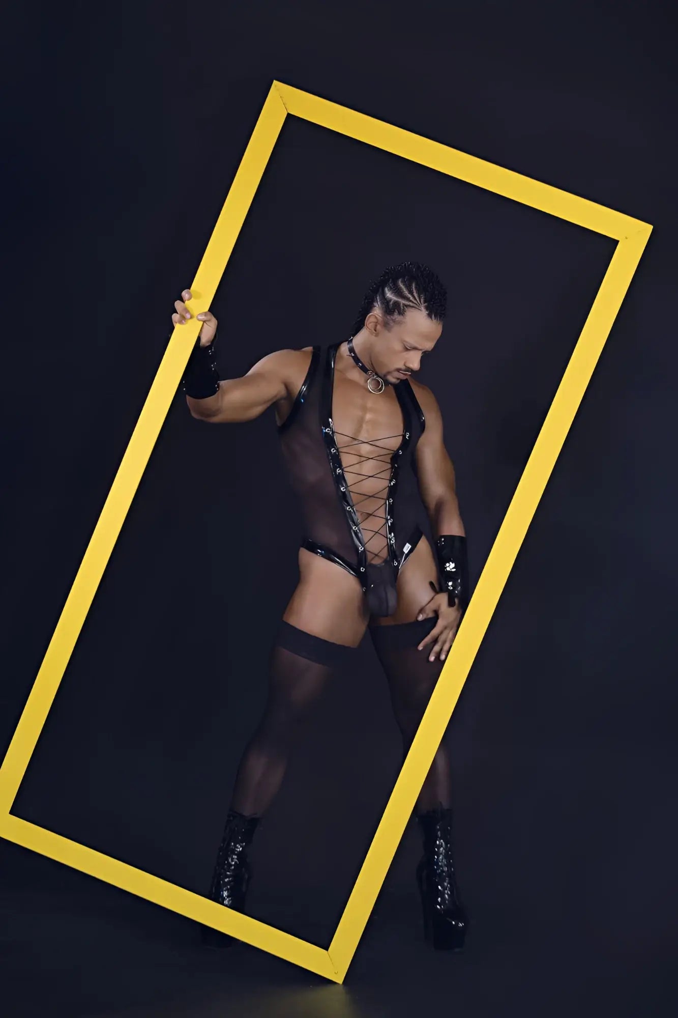 A bold yellow rectangular frame with a thin border highlighting the black candyman 99774 gladiator bodysuit front view