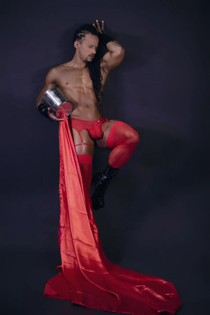 Shiny red satin fabric flowing from a mans leg showcasing candyman 99792 mesh garter thongs in red