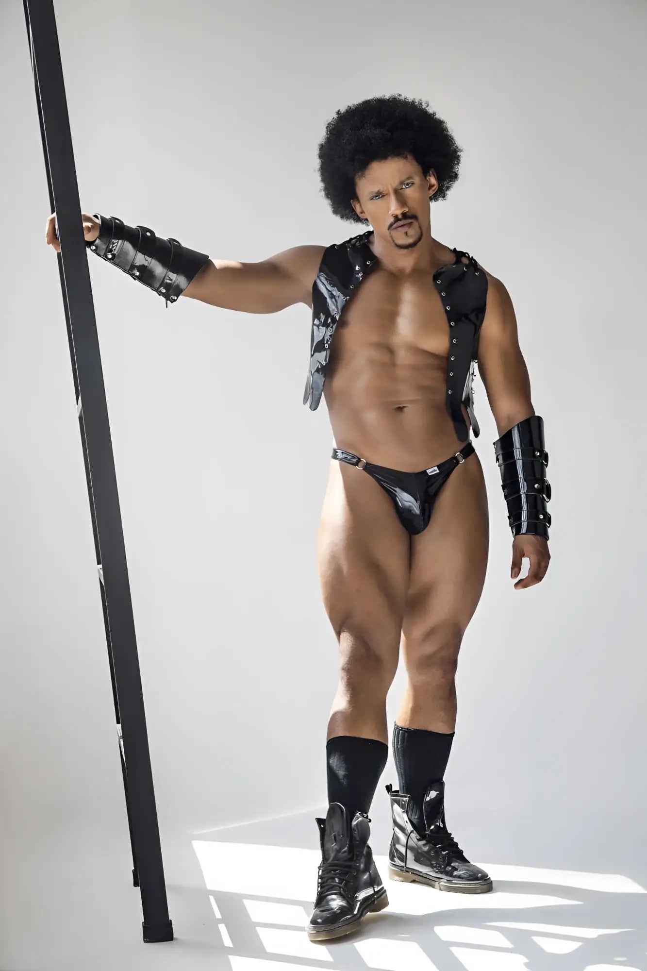 Black leather vest with silver studs and matching black armored arm guards from candyman 99819 dom thongs gloss black collection