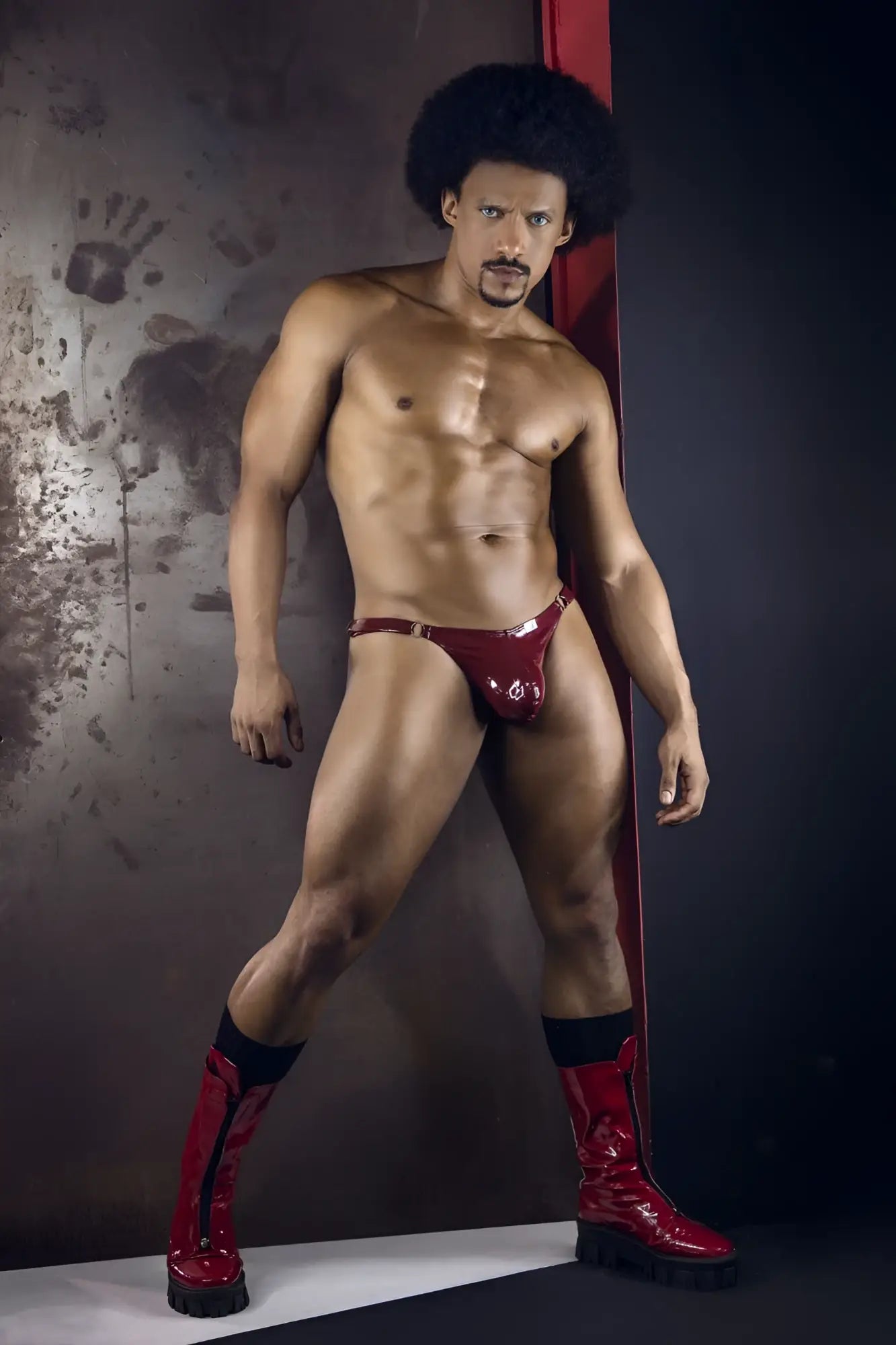 Shiny red latex thong with metallic buckle from CandyMan 99819 Dom Thongs color gloss wine shown from the back side