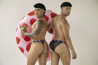 Pink inflatable strawberry pool float shown with black CandyMan 99936 thongs for poolside use