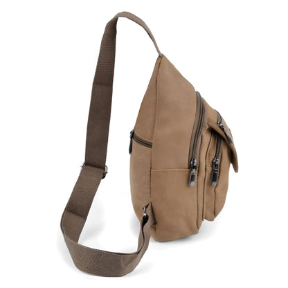 Tan canvas sling bag with multiple zippered compartments and sturdy adjustable shoulder strap for easy carrying