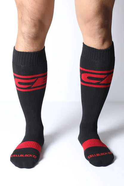 Black knee-high socks with red stripes and logo featuring a snug fit by CellBlock 13