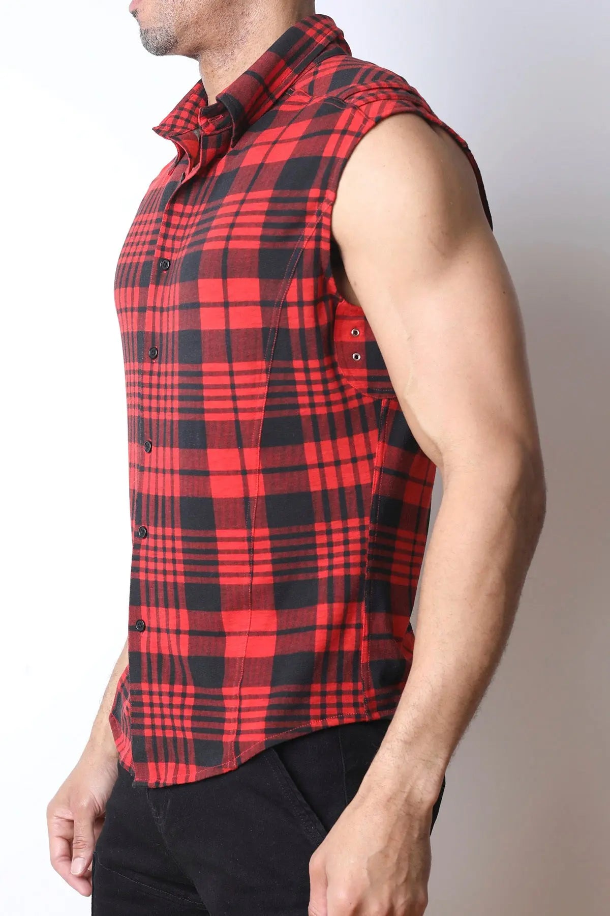 Red and black plaid sleeveless shirt by CellBlock 13 featuring a button-up front and a fitted design shown on a model from the side