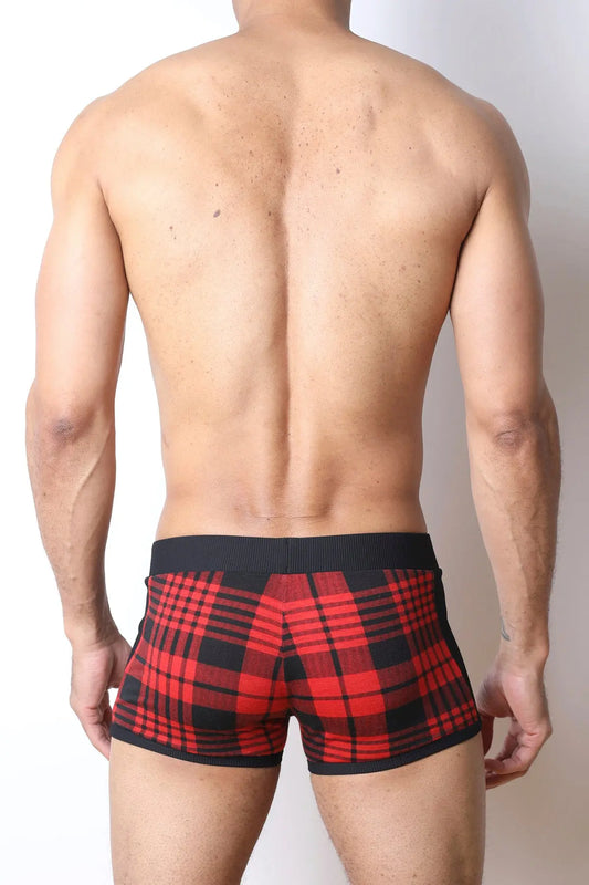 Red and black plaid trunk underwear with a black waistband shown on a model from the back by CellBlock 13