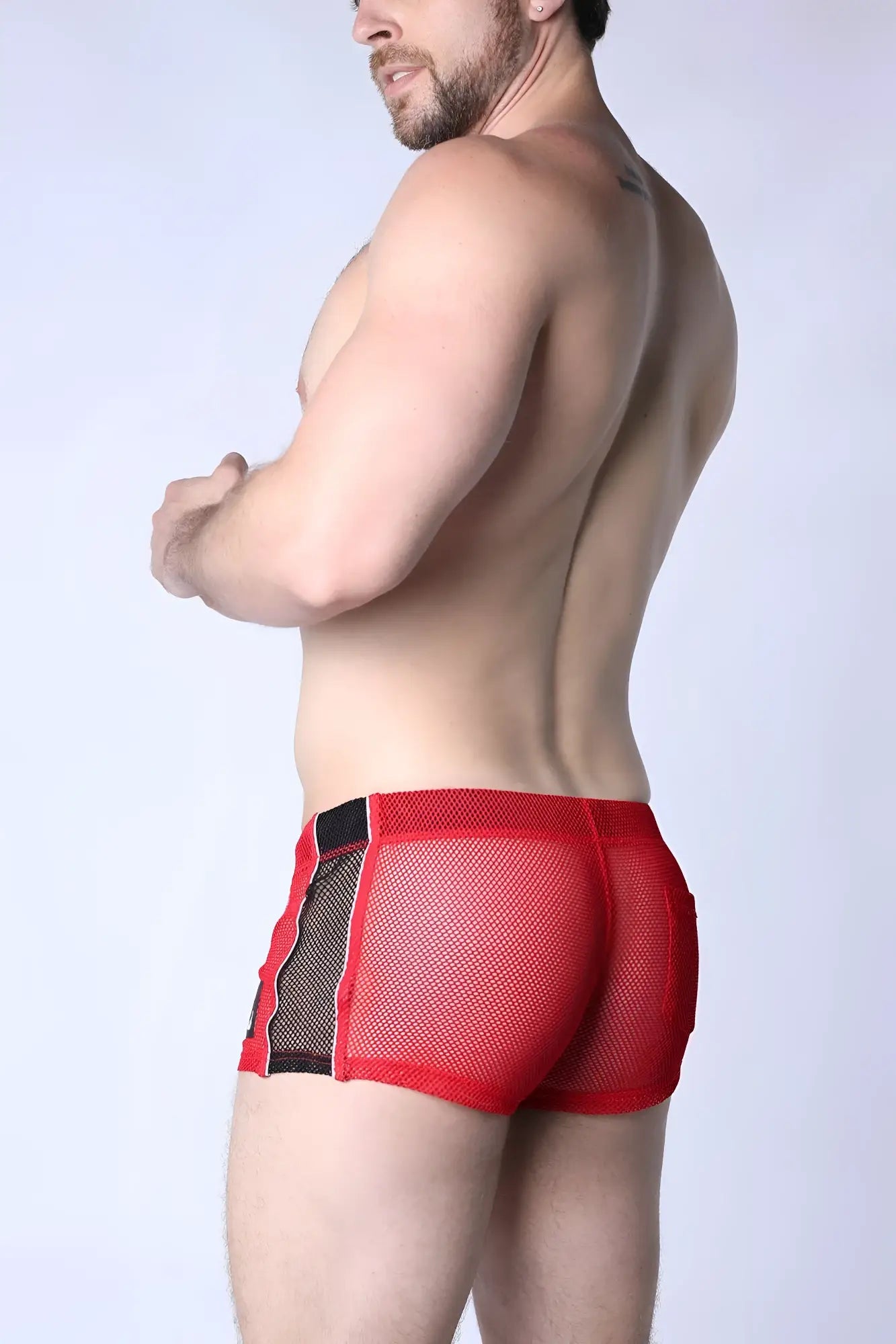 Red mesh briefs with black side panels from chain reaction mesh short featuring breathable mesh material