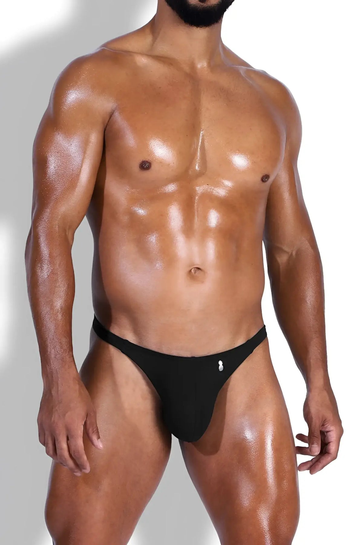 Black cheeky classic g-string thong with a small white logo on the front perfect for everyday wear