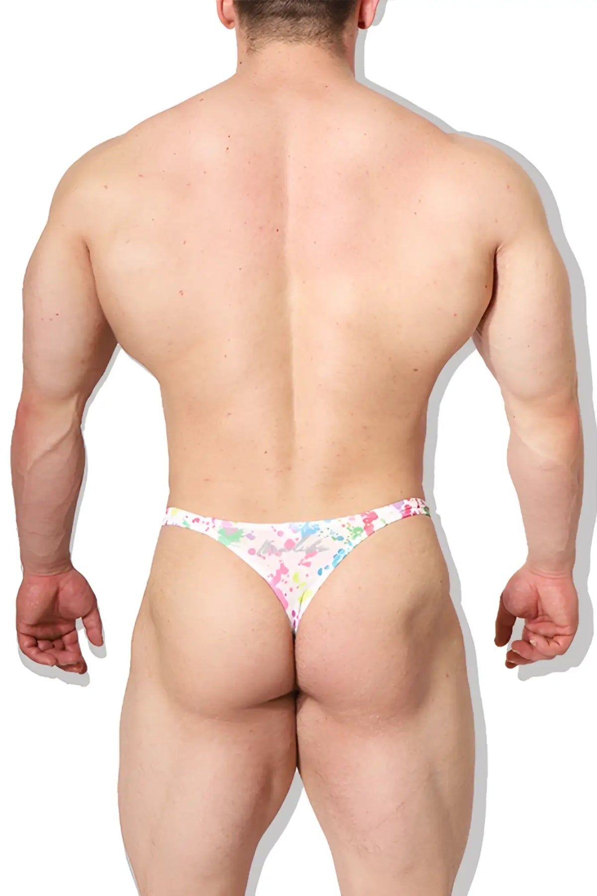 White cheeky classic g-string thong with colorful floral paint splash pattern showing the back side