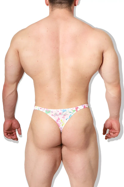White cheeky classic g-string thong with colorful floral paint splash pattern showing the back side