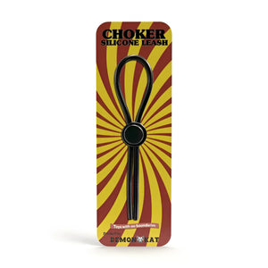 Black silicone choker leash with central circular ring packaged in red and yellow sunburst design