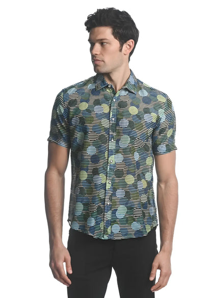 A men’s short-sleeved cotton silk button-up shirt with vibrant green blue and yellow overlapping circles on a dark base