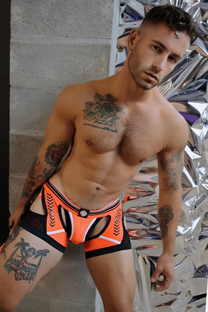 Orange and black athletic-style briefs with white trim and a central logo on the waistband called Circuit Breaker Chock