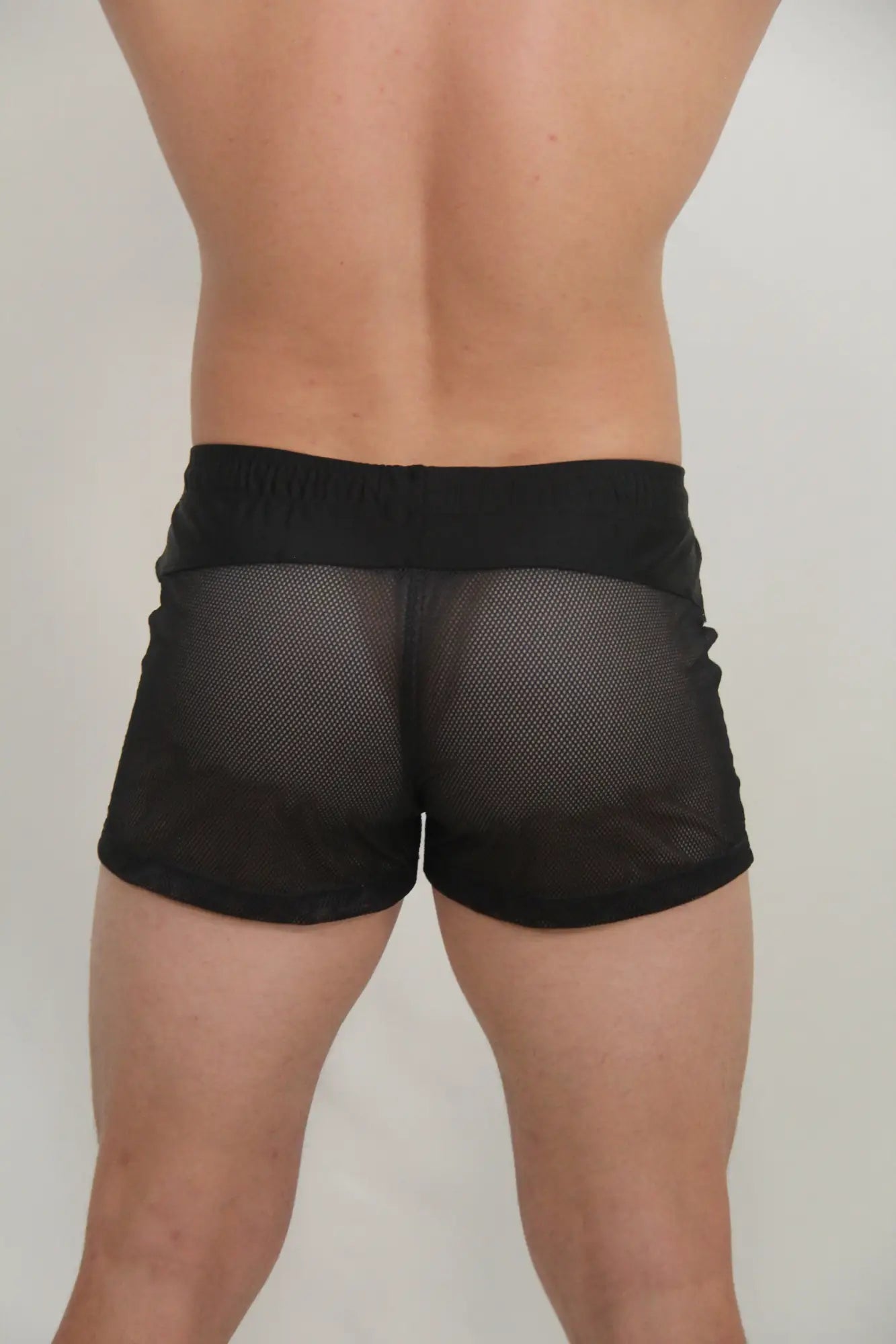 Black mesh shorts with solid black waistband from circuit mesh short collection available in four colors
