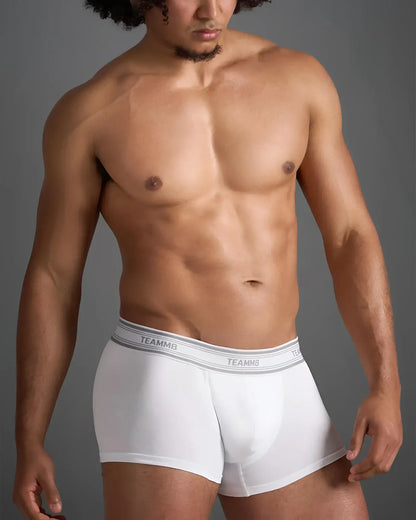White classic cotton trunk boxer briefs with gray elastic waistband featuring repeating brand name lettering