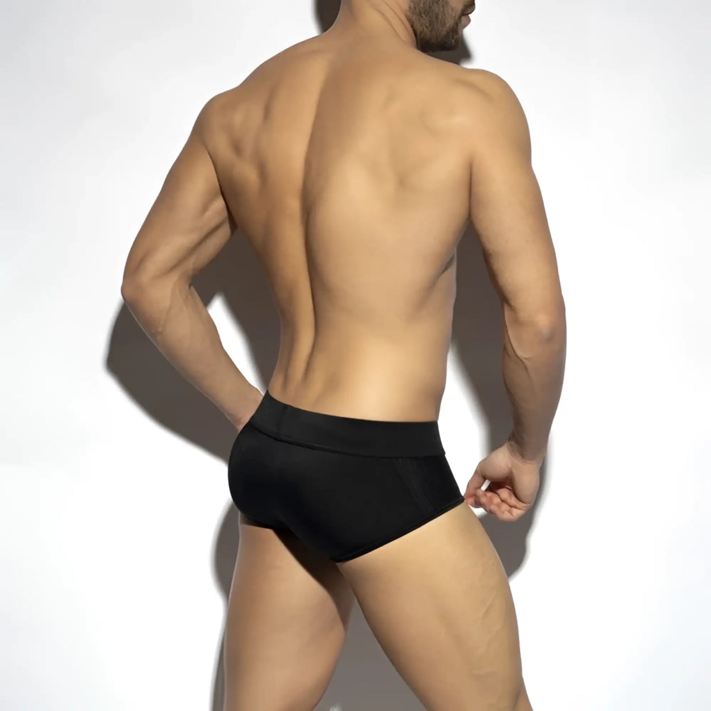 Black classic swim brief with textured mesh panels on the sides designed for athletic performance and comfort