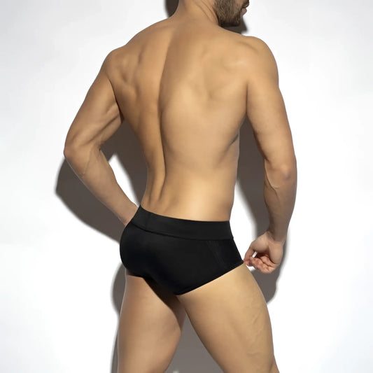 Black classic swim brief with textured mesh panels on the sides designed for athletic performance and comfort